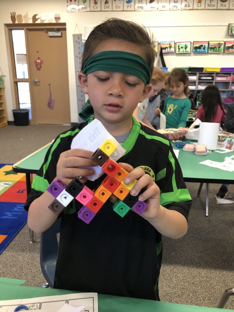 Student plays with blocks